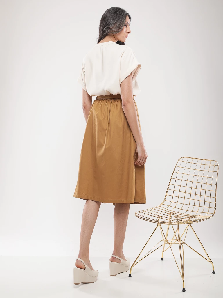 Jupe midi plissée à ceinture nouée