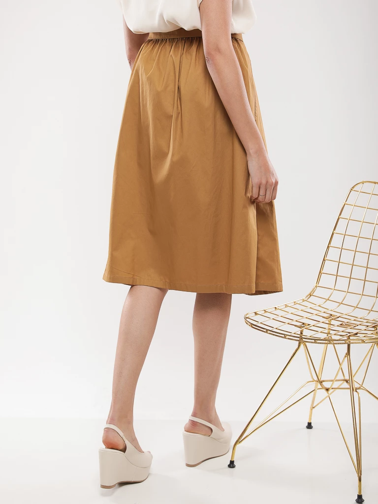 Jupe midi plissée à ceinture nouée
